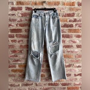 Baggy, light-wash straight jean with distressed design. Size 26